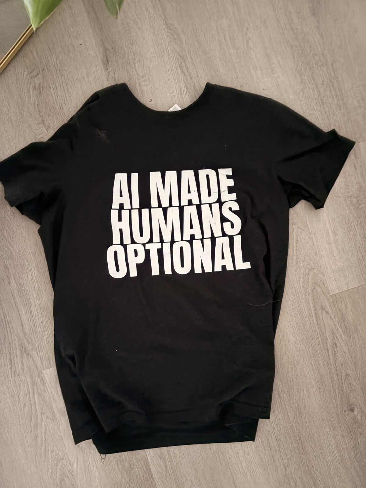 Original photographed first sample of the AI Made Humans Optional tee
